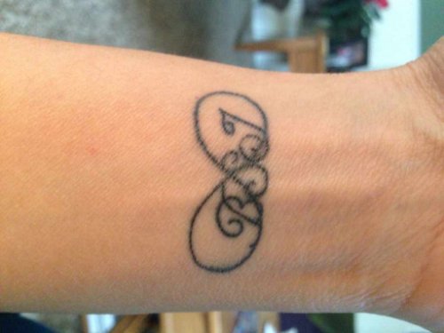 Wonderful Black Ink Infinity Tattoo On Left Wrist