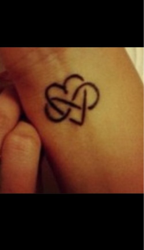Black Ink Heart And Infinity Tattoo On Wrist