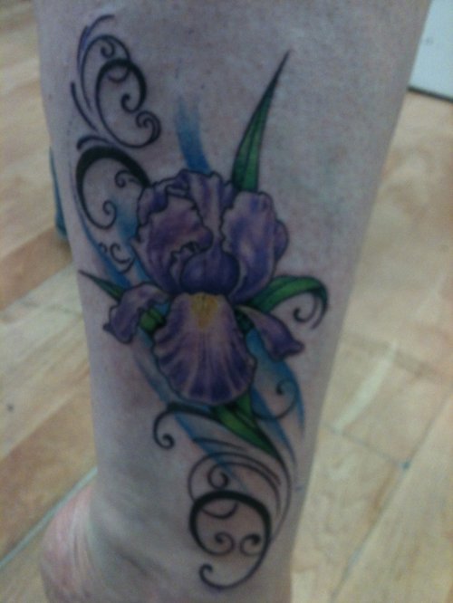 Iris Tattoo On Girl Left Leg