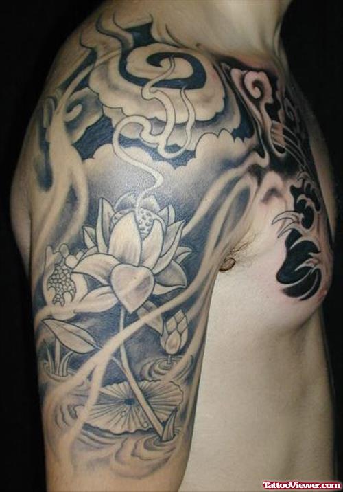 Grey Ink Lotus Flower And Japanese Tattoo On Right Shoulder