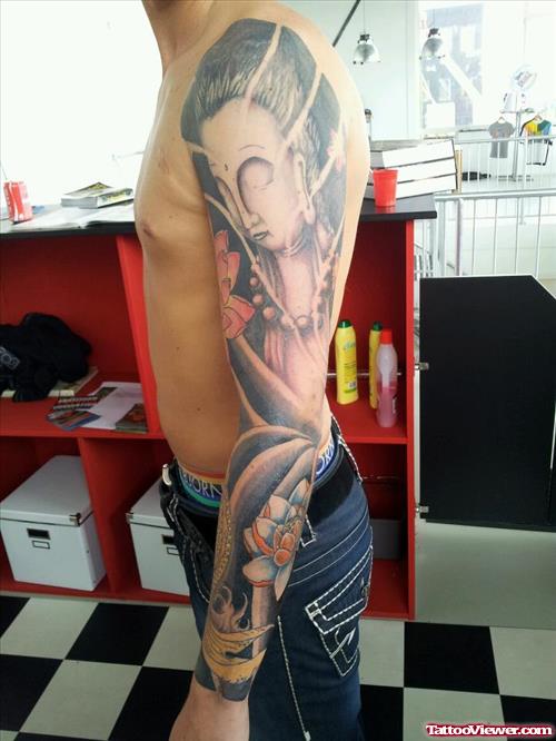 Grey Ink Japanese Tattoo On Man Left Sleeve