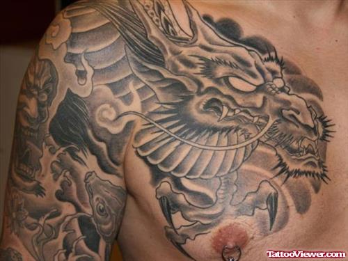 Grey Ink Japanese Dragon Tattoo On Man Chest
