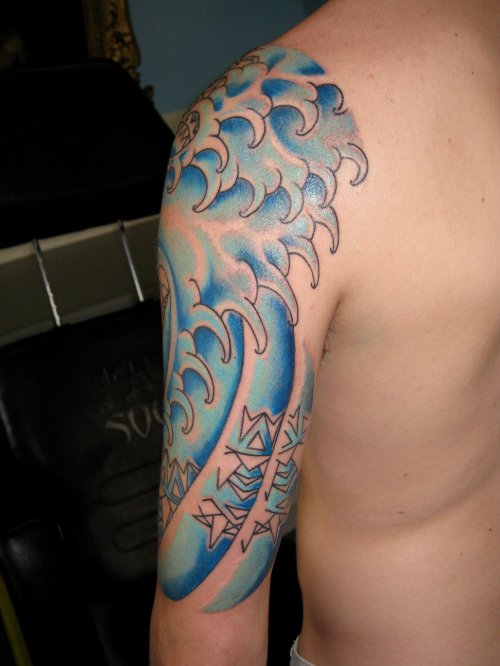 Blue Ink Japanese Waves Tattoo On Half Sleeve