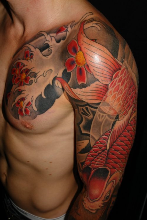 Color ink Japanese Tattoo On Man Chest And Left Sleeve