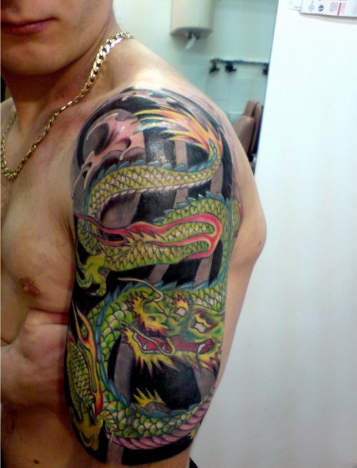 Green Ink Japanese Dragon Tattoo On Left Half Sleeve