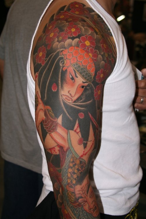 Awesome Colored Japanese Tattoo On Man Right Sleeve