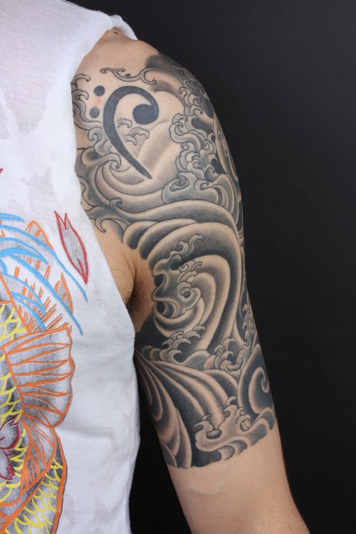 Awesome Grey Ink Japanese Tattoo On Half Sleeve