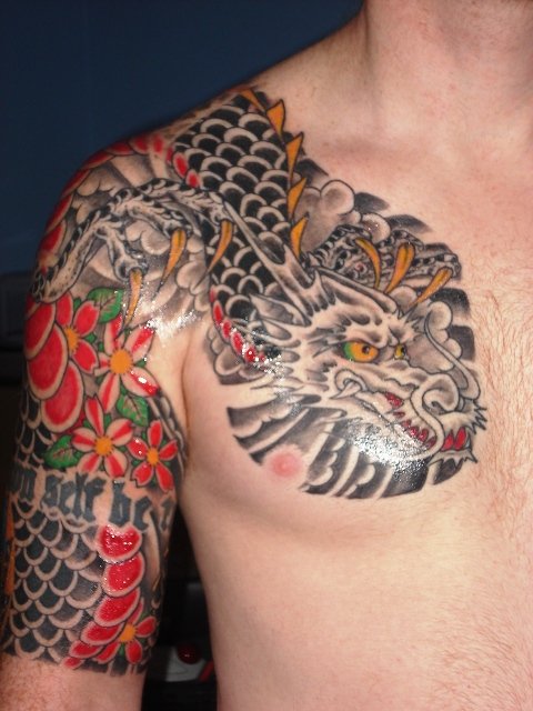 Colored Japanese Tattoo On Man Right Shoulder and Chest