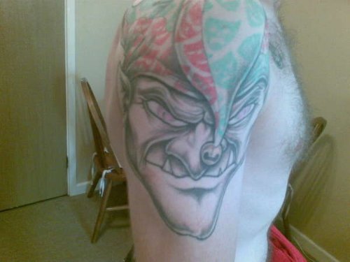 Evil Jester Tattoo On Man Right Half Sleeve