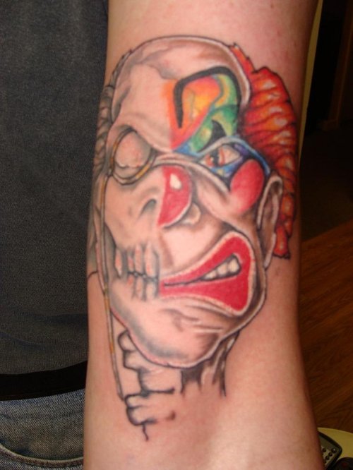 Colored Jester Clown Tattoo On Left Sleeve