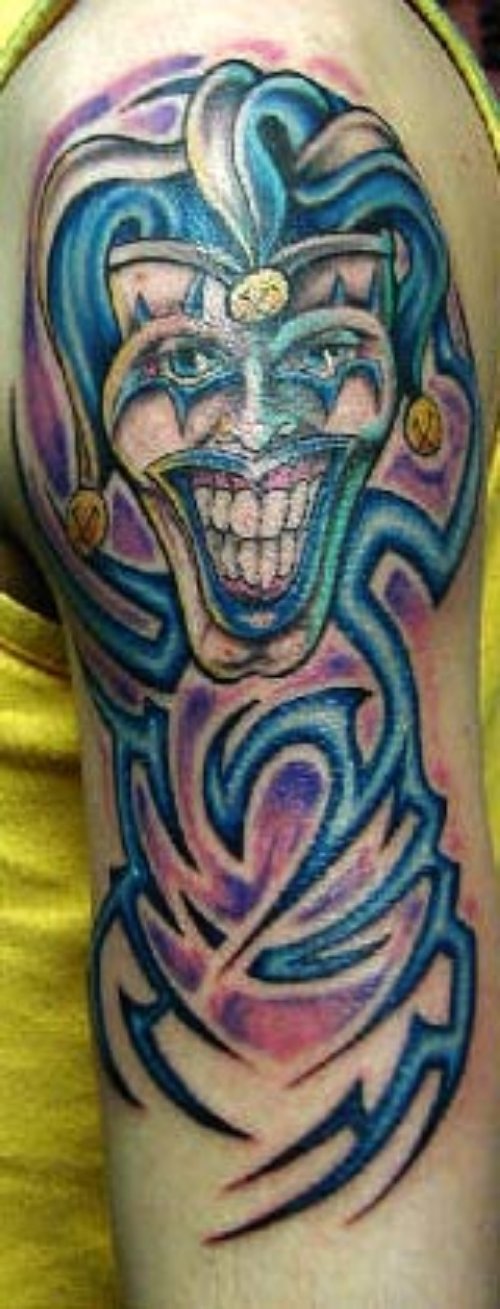 Blue Ink Tribal Jester Tattoo On Left Sleeve