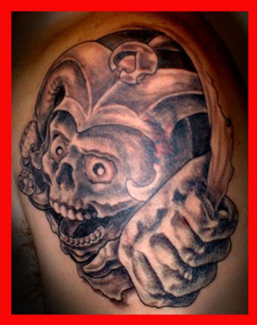Awful Grey Ink Jester Tattoo On Man Left Shoulder
