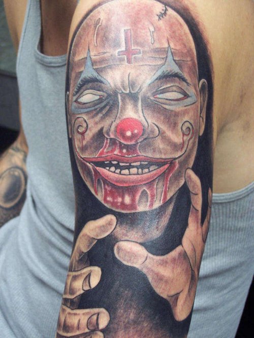 Zombie Bleeding Jester Tattoo On Left Sleeve