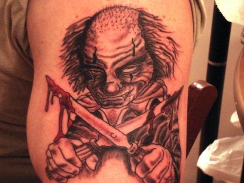 Scary clown With Knife Tattoo On Half Sleeve
