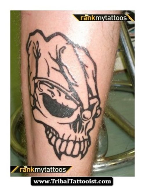 Outline Skull Jester Tattoo On Leg