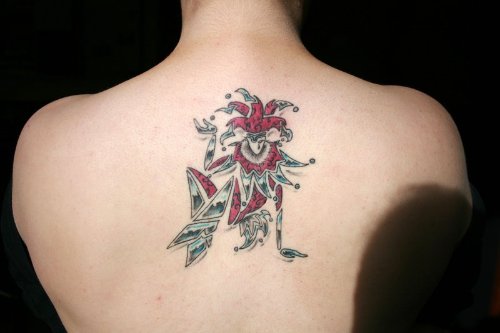 Jester Tattoo On Man Upperback