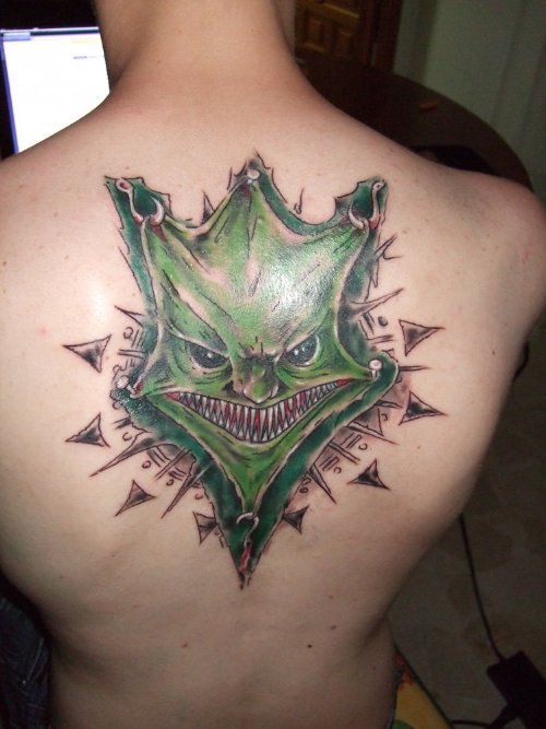 Green Ink Jester Tattoo On Back