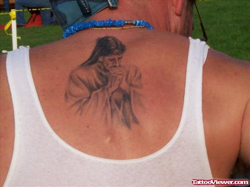 Grey Ink Jesus Christ Tattoo On Man Upperback