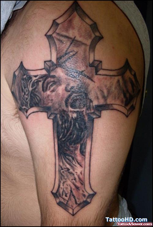 Grey Ink Jesus Christ Face In Cross Tattoo On Left Half Sleeve