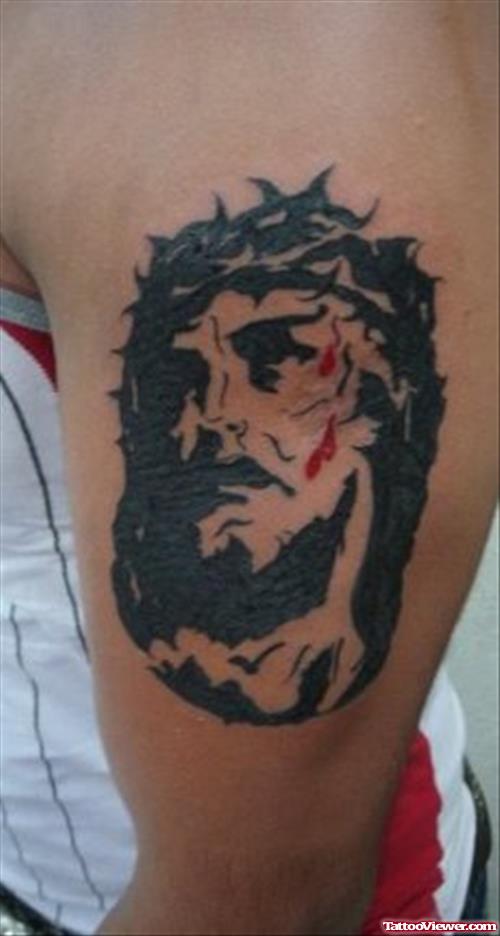 Black Ink Jesus Christ Tattoo On Left Bicep