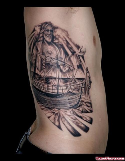 Grey Ink Ship And Jesus Tattoo On Side