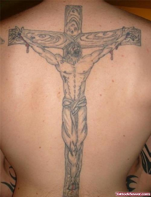 Grey Ink Cross And Jesus Tattoo On Man Back
