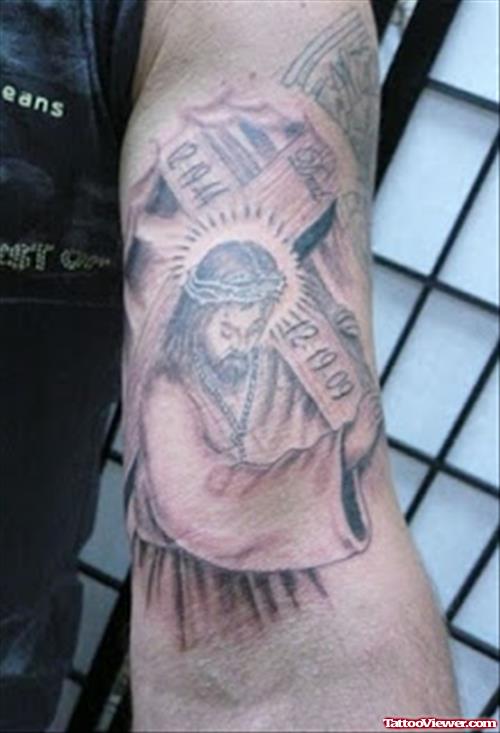Grey Ink Jesus And Cross Tattoo On Left Sleeve