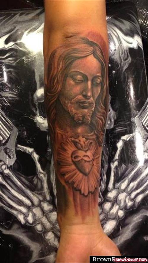 Grey Ink Heart And Jesus Tattoo On Left Forearm
