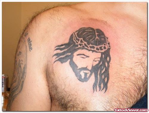 Black Ink Jesus Head Tattoo On Man Chest