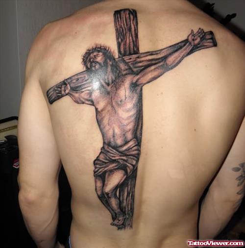 Grey Ink Cross And Jesus Tattoo On Man Back Body