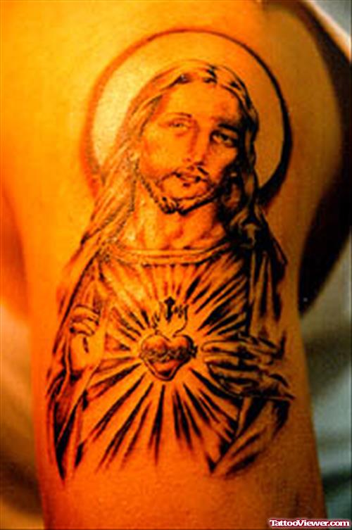 Grey Ink Jesus Tattoo On Shoulder