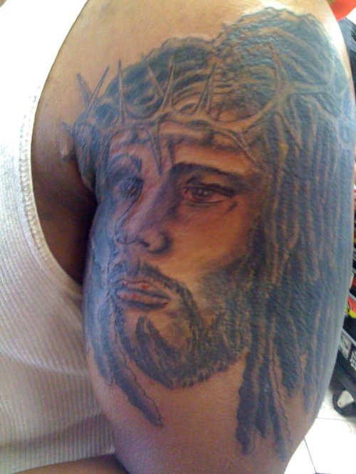 Black Ink Jesus Head Tattoo On Half Sleeve