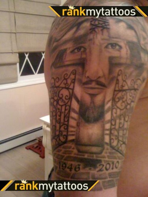 Grey Ink Cross And Jesus Face Tattoo On Man Right Half Sleeve