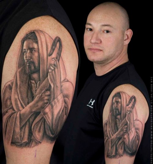 Awesome Grey Ink Jesus Tattoo On Left Biceps