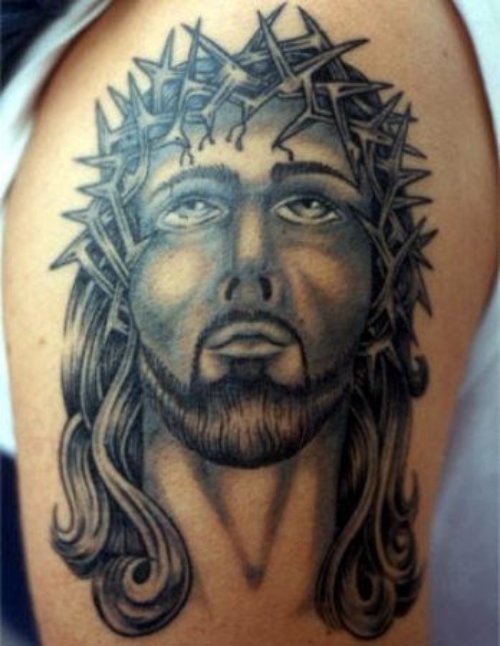 Grey Ink Jesus Head Tattoo On Shoulder