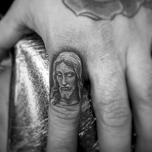 Small Jesus Head Tattoo On Finger