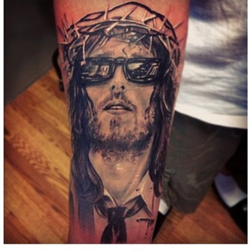 Funky Jesus With Goggles Tattoo On Right Arm