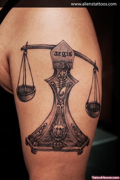 Grey Ink Justice Tattoo On Half Sleeve