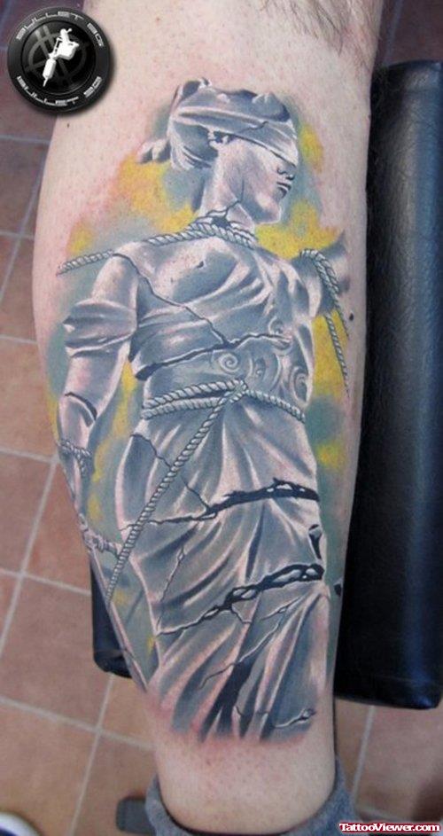 Grey Ink Justice Tattoo On Right Leg