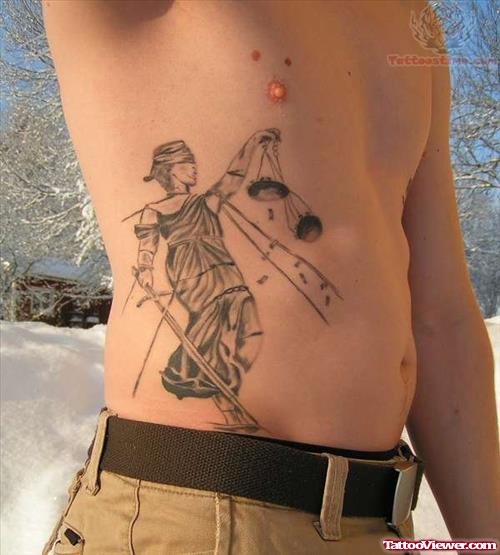 Grey Ink Justice Tattoo On Man Side Rib