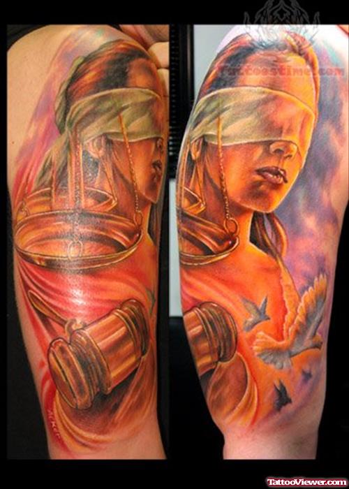 Colored Blind Lady Justice Tattoo On Sleeve