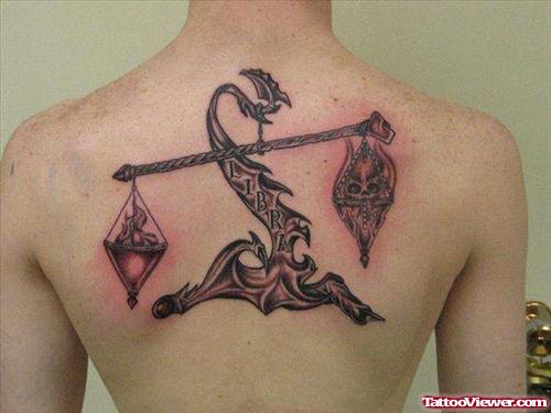 Grey Ink Justice Tattoo On Upperback