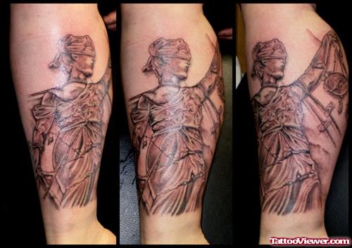 Amazing Grey Ink Justice Tattoo On Arm