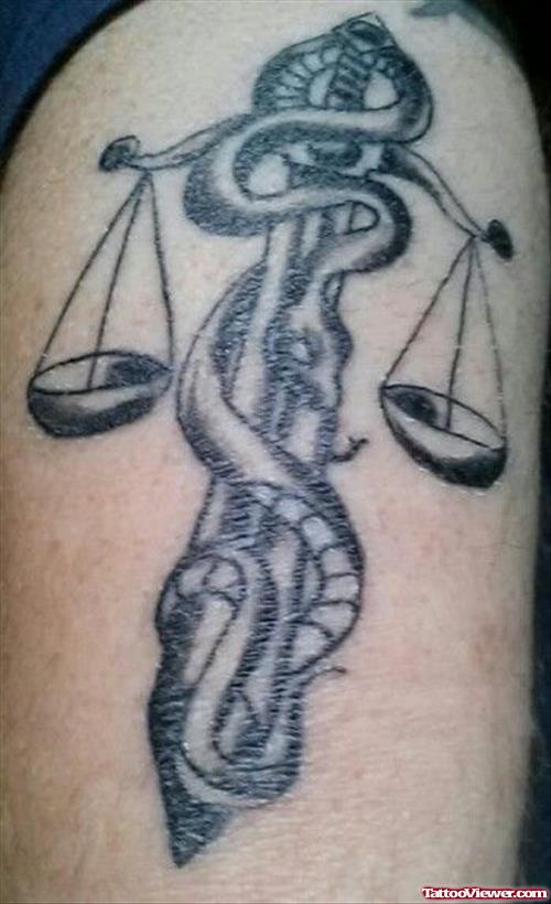 Amazing Grey Ink Justice Tattoo On Half Sleeve