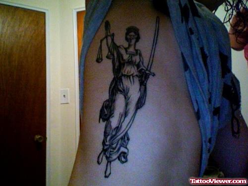 Justice Tattoo On Rib Side
