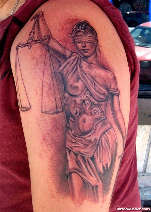 Grey Ink Justice Tattoo On Man Left Half Sleeve