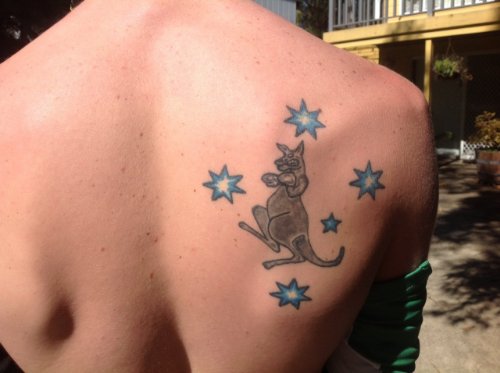 Blue Stars And Kangaroo Tattoo On Right Back Shoulder
