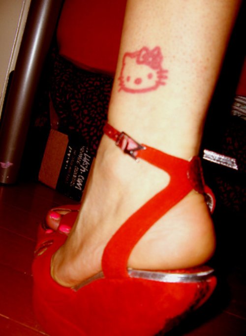 Red Ink Kitty Head Tattoo On Leg
