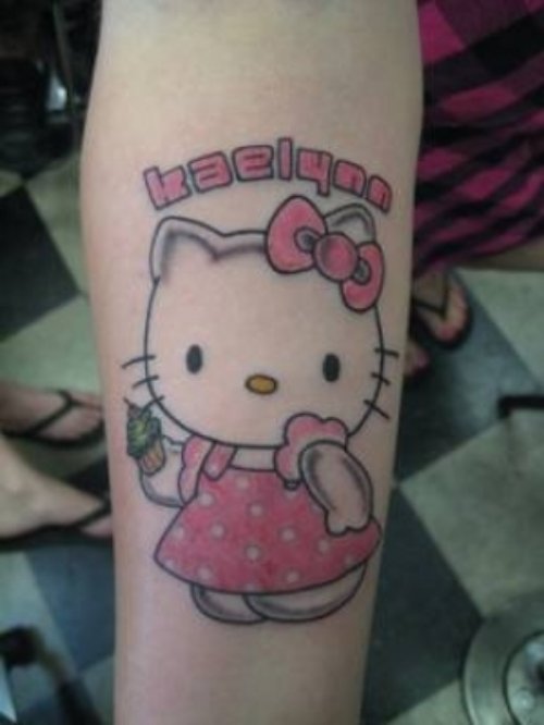 Red Ink Hello Kitty Tattoo On Arm