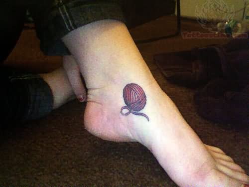 Kniiting Yarn Tattoo On Left Foot